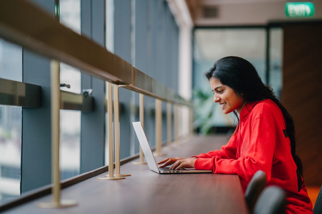 woman looking at laptop on the office