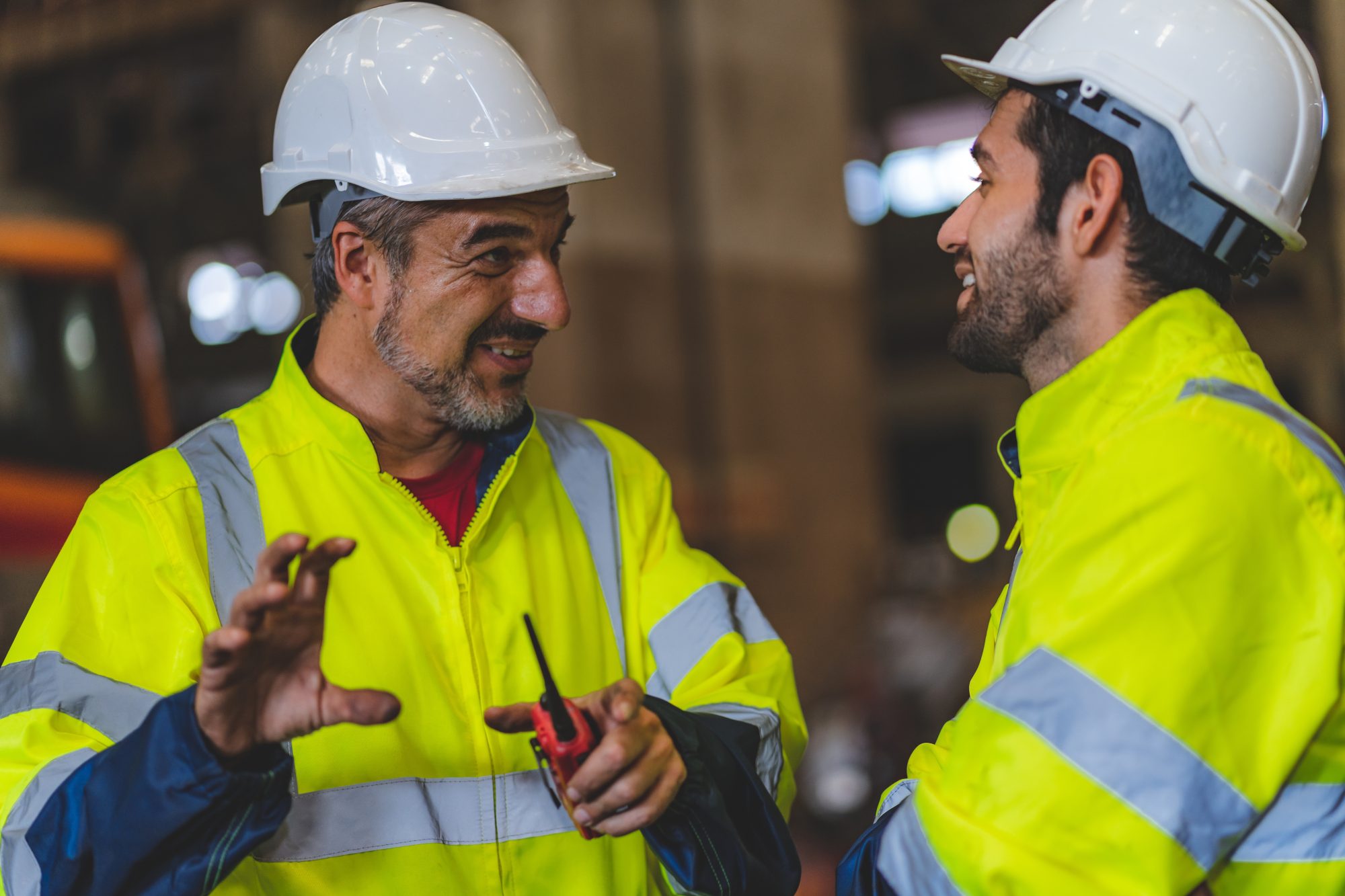 two engineers in PPE talking