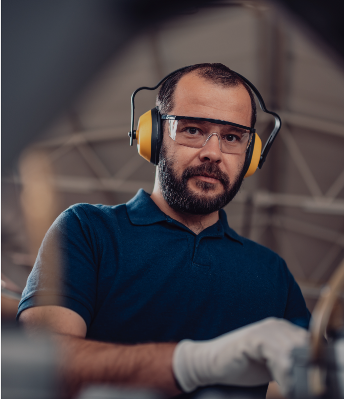 Engineer in PPE operating machine