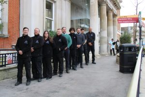 group of men in front of King's College London